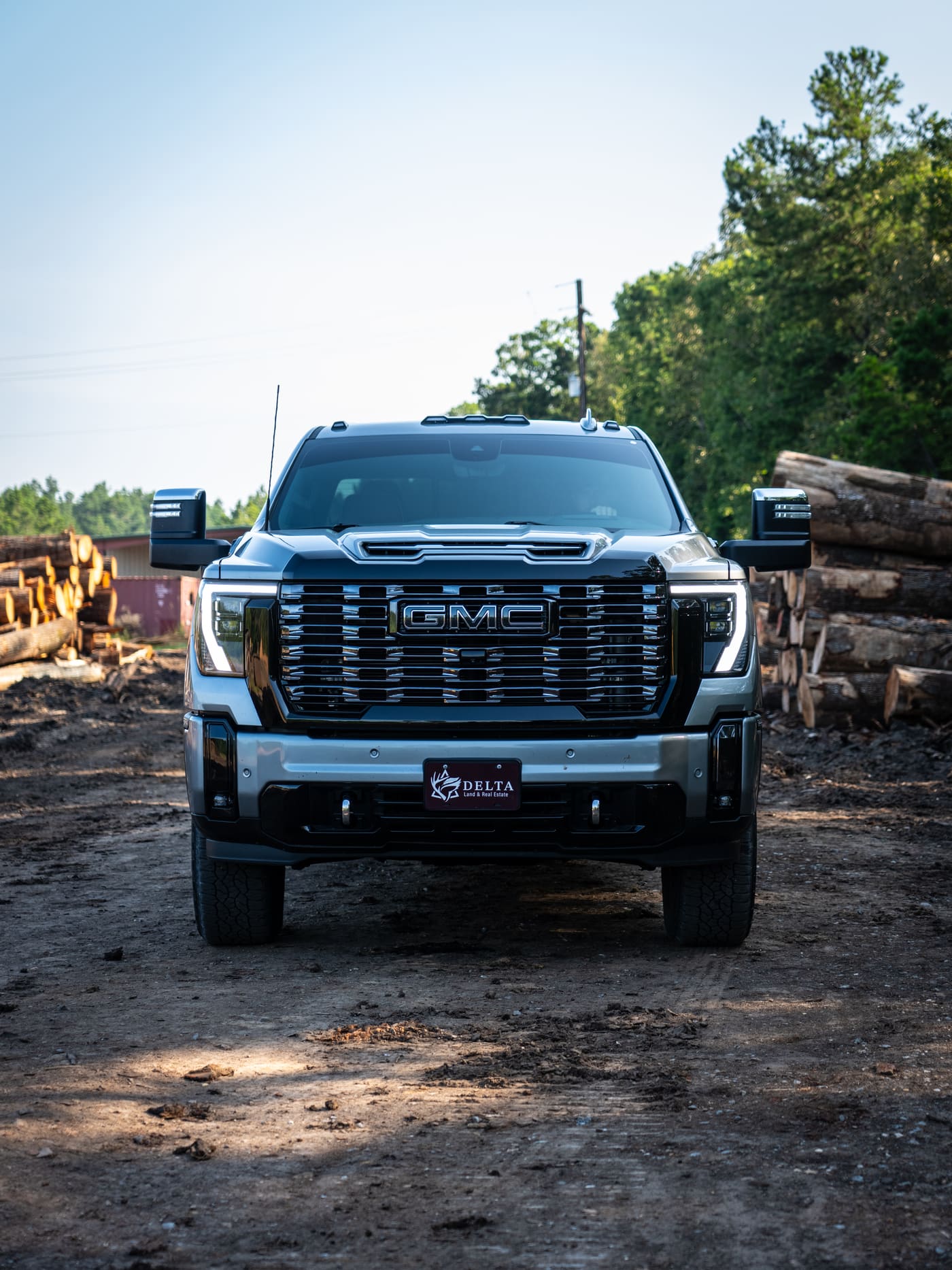 Delta Land truck at a log yard